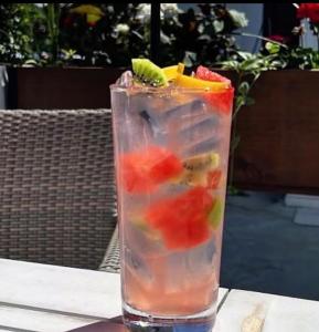 a drink with fruit in it sitting on a table at Hotel mong'are in Narok