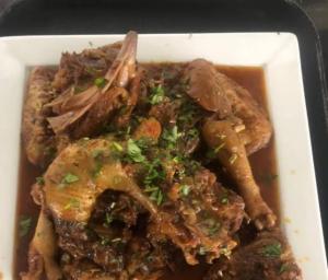 a styrofoam container of food with meat and gravy at Hotel mong'are in Narok
