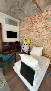 a bedroom with a bed with a mask on it at Residenza SOGNO in Biella
