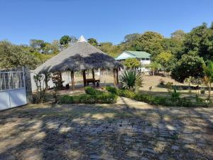 a gazebo with a thatch roof at Villa Armor 2 in Nosy Be