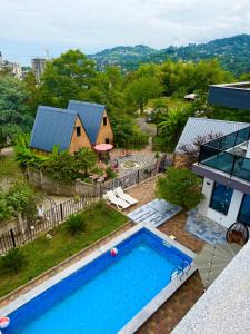 an aerial view of a house with a swimming pool at SEA Side-მზის მხარე- N 1 in Makhinjauri