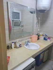 a bathroom counter with a sink and a tv at شاليه بلومار السخنة in Ain Sokhna +12 photos