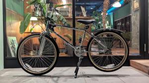 a bike is parked in front of a store at Hotel Pacific Kanazawa in Kanazawa