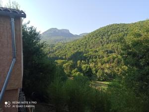 a view of the mountains from a house at Gîte au calme  +6 photos