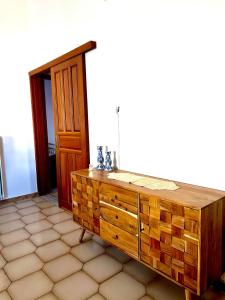 a wooden dresser in a room with a door at Kastelia in Yéfira +34 photos