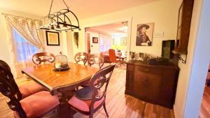 a dining room with a table and chairs at Cannon House Retreat in Fayetteville