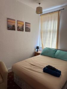 a bedroom with a large bed with a window at Mirage Hotel in Blackpool +15 photos