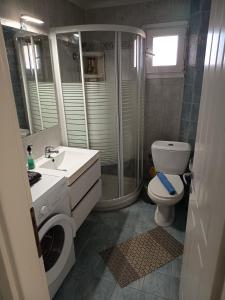 a bathroom with a toilet sink and a shower at Chéz Vasŏ ** leisure maisonette** in Kassandra +23 photos