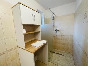 a bathroom with a sink and a shower at Apartmány Bartoš Vitanová in Vitanová +11 photos