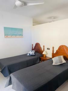 two beds sitting next to each other in a bedroom at Can Llança in Llança
