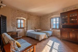 a bedroom with two beds and a couch at Borgo San Valentino in Arrone +213 photos