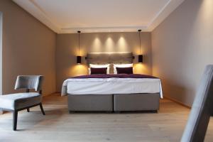 Postel nebo postele na pokoji v ubytování Hotel Aurelia