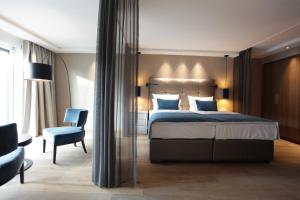 Postel nebo postele na pokoji v ubytování Hotel Aurelia