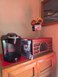 a microwave sitting on top of a table with a coffee maker at Hampton House in Clinton