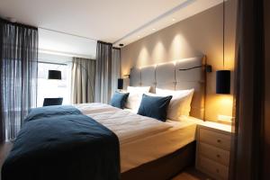 Postel nebo postele na pokoji v ubytování Hotel Aurelia