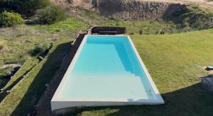 an overhead view of a swimming pool in a field at North beach Pinamar in Pinamar +7 photos