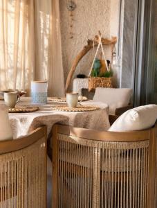 a dining room with two tables and two chairs at Eden rock apartment in Grimaldi