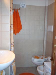 a bathroom with a toilet and a sink at La Piccola Masseria in Cisternino +37 photos