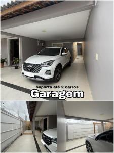 a garage with a white car parked in it at Casa grande e confortável! in Petrolina