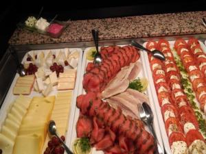 a tray of food with meats and cheese on a table at Landhaus Sundern in Tecklenburg +13 photos