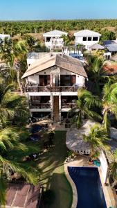 an aerial view of a house with a swimming pool at Wind Village in Itarema