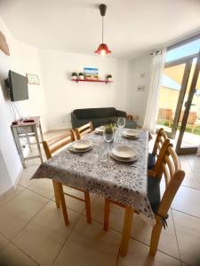 a dining room table with a table cloth on it at Casa Vega in El Cotillo