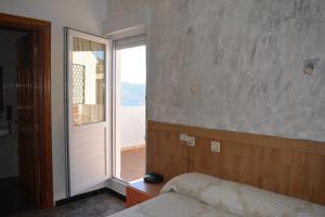 Postel nebo postele na pokoji v ubytování Hostal Manolete