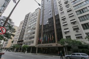 a large building with a car parked in front of it at Mirador Rio Copacabana Hotel in Rio de Janeiro