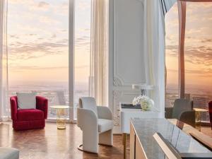 a living room with a view of the city at Raffles Doha in Doha +236 photos