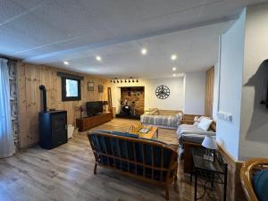 a living room with a couch and a table at Loft Rural Con Encanto in La Coromina