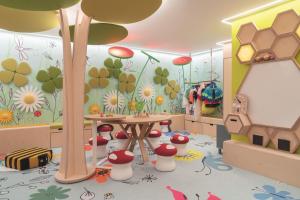 a room with a table and flowers on the wall at Cheval Blanc Paris & Dior Spa Cheval Blanc Paris in Paris