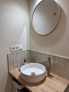 a bathroom with a large white sink and a mirror at Casa Limón in Bodonal de la Sierra +14 photos