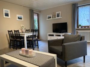 a living room with a couch and a table at Ferienwohnung Tannenhöh in Todtmoos
