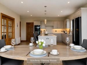 a kitchen and dining room with a table and chairs at Sonas in Letterkenny
