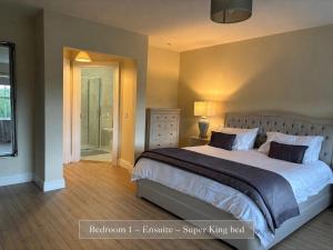 a bedroom with a large bed and a window at Sonas in Letterkenny