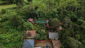 an overhead view of a house in the forest at Wayanad Way Resort in Koroth