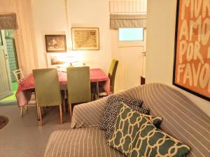 a living room with a couch and a table at 2 Bedroom-Boho-Style-Apartment in Sankt Veit an der Glan