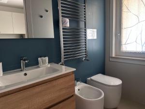 a bathroom with a white sink and a toilet at B&B le Pontine in Gaeta +33 photos