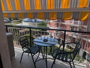 a table and chairs on a balcony with a view at B&B le Pontine in Gaeta