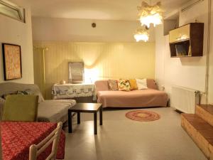 a living room with a bed and a couch at 2 Bedroom-Boho-Style-Apartment in Sankt Veit an der Glan