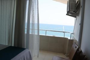 a room with a window with a view of the ocean at Hakan Pension in Merdivenlikuyu +54 photos
