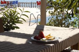 a plate of food on a table with a plate of food at Hakan Pension in Merdivenlikuyu