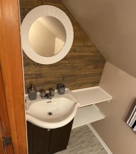 a bathroom with a sink and a mirror at Rustic Villa Country Getaway in Saint-Gabriel-de-Brandon +72 photos