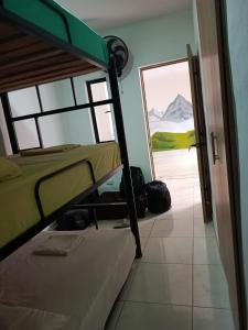 a bunk bed room with a view of a mountain at Multiverse Hostel in Medellín
