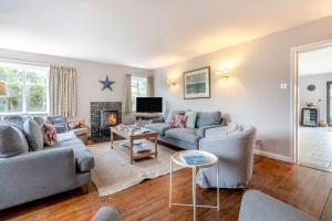 a living room with two couches and a tv at 5 Bed in Walberswick oc-hlodg2 in Walberswick
