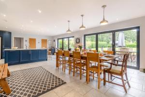 a kitchen and dining room with a table and chairs at 5 Bed in Walberswick oc-hlodg2 in Walberswick