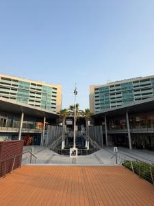 a large building with a fountain in the middle of it at Marina private see view room in Abu Dhabi