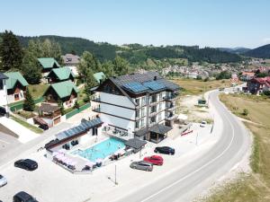 an aerial view of a hotel with a pool and a road at Meandri in Nova Varoš