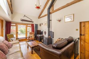 a living room with a couch and a table at 4 Bed in Hawkshead oc-lr116 in Hawkshead