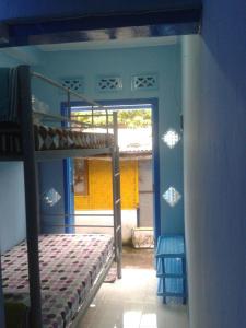 Postel nebo postele na pokoji v ubytování Jogja Backpacker Home
